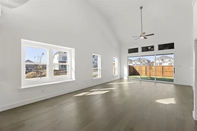 a view of a hallway with a ceiling fan
