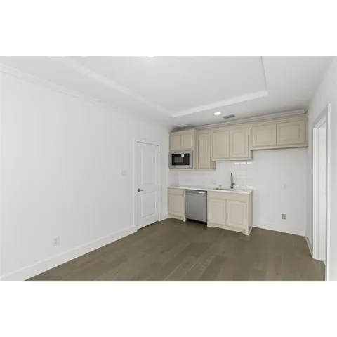 a bathroom with a double vanity sink toilet mirror and bathtub