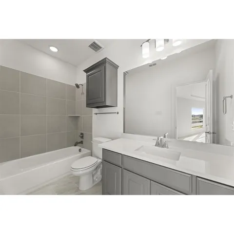 a kitchen with kitchen island a sink stainless steel appliances and cabinets