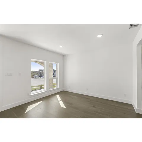 a kitchen with kitchen island sink stove and refrigerator