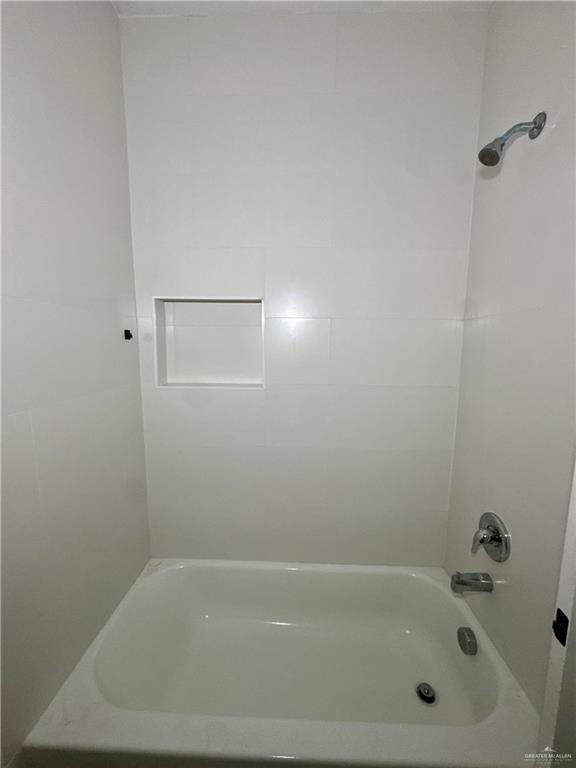 720 Ragland Road, Unit 8 Mission, TX 78572 - Photo 7 of 17 a bathroom with a bathtub