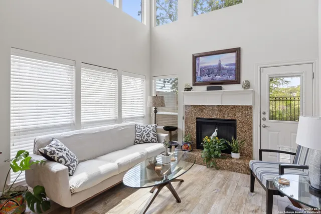 a living room with furniture and a fireplace
