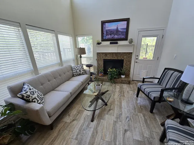 a living room with furniture and a fireplace