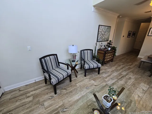 a view of a room with lounge chair and wooden floor