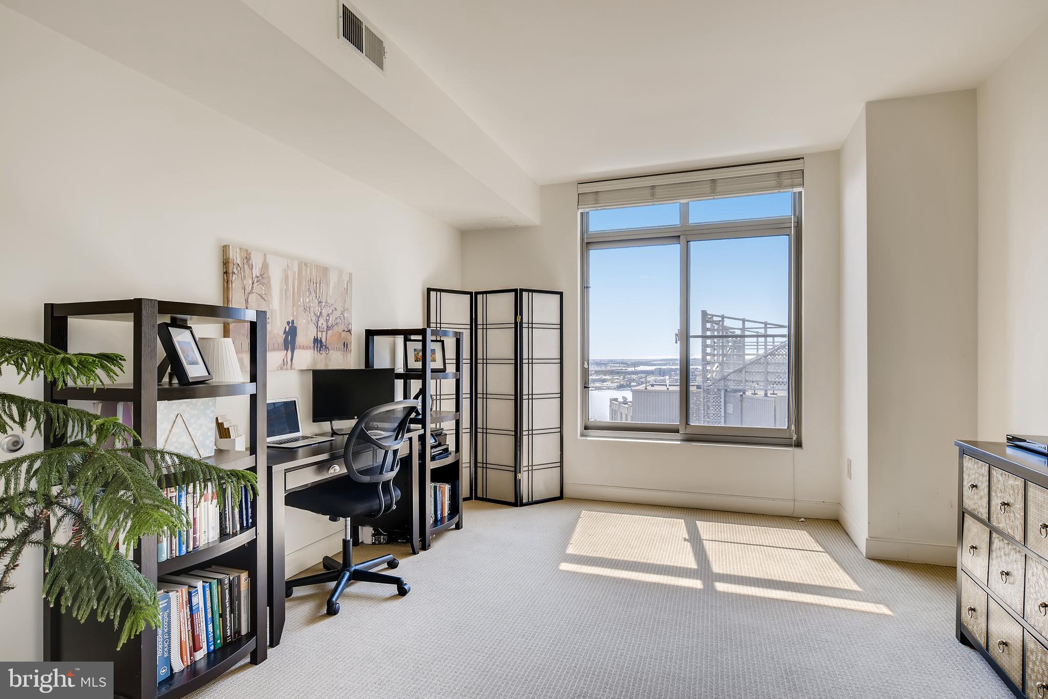 675 President Street, Unit 2105 Baltimore, MD 21202 - Photo 22 of 40 a view of a workspace with furniture and a window