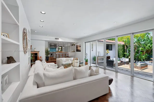 a kitchen with stainless steel appliances granite countertop a sink and a refrigerator