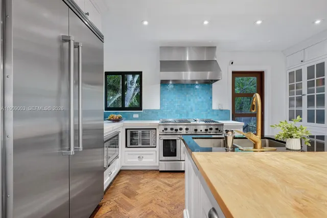 a kitchen with a table and chairs in it
