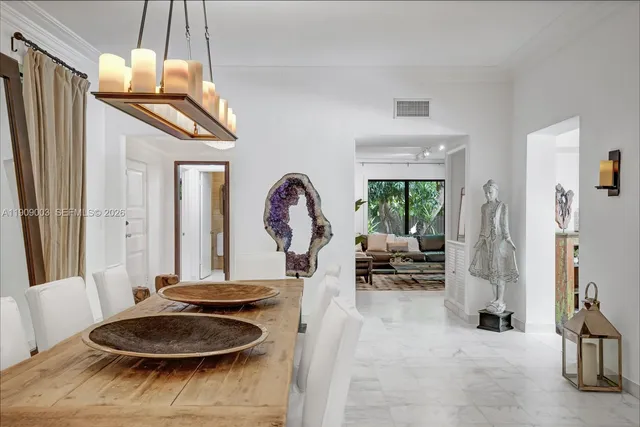 a bedroom with a large bed and a large window