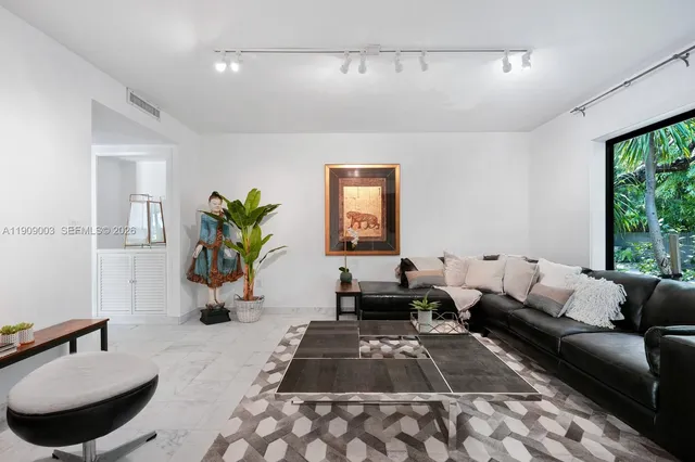 a living room with furniture and a rug