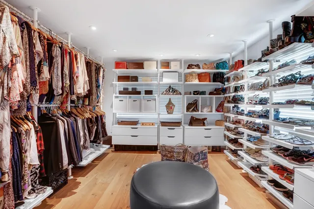 a bed room with a bed window and potted plant
