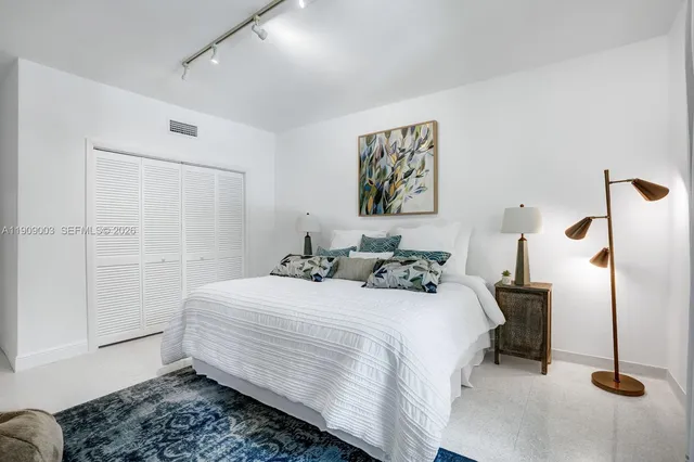 a garden with trees in the background