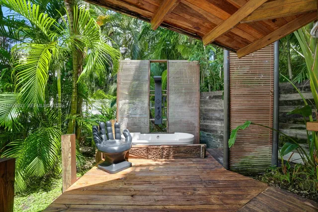 an aerial view of a house with a lake view