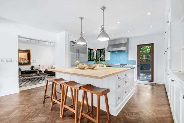 a view of a livingroom with furniture and a flat screen tv