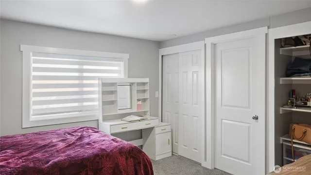 a bathroom with a shower and a glass door