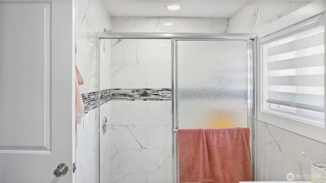 a bathroom with a sink vanity granite and toilet