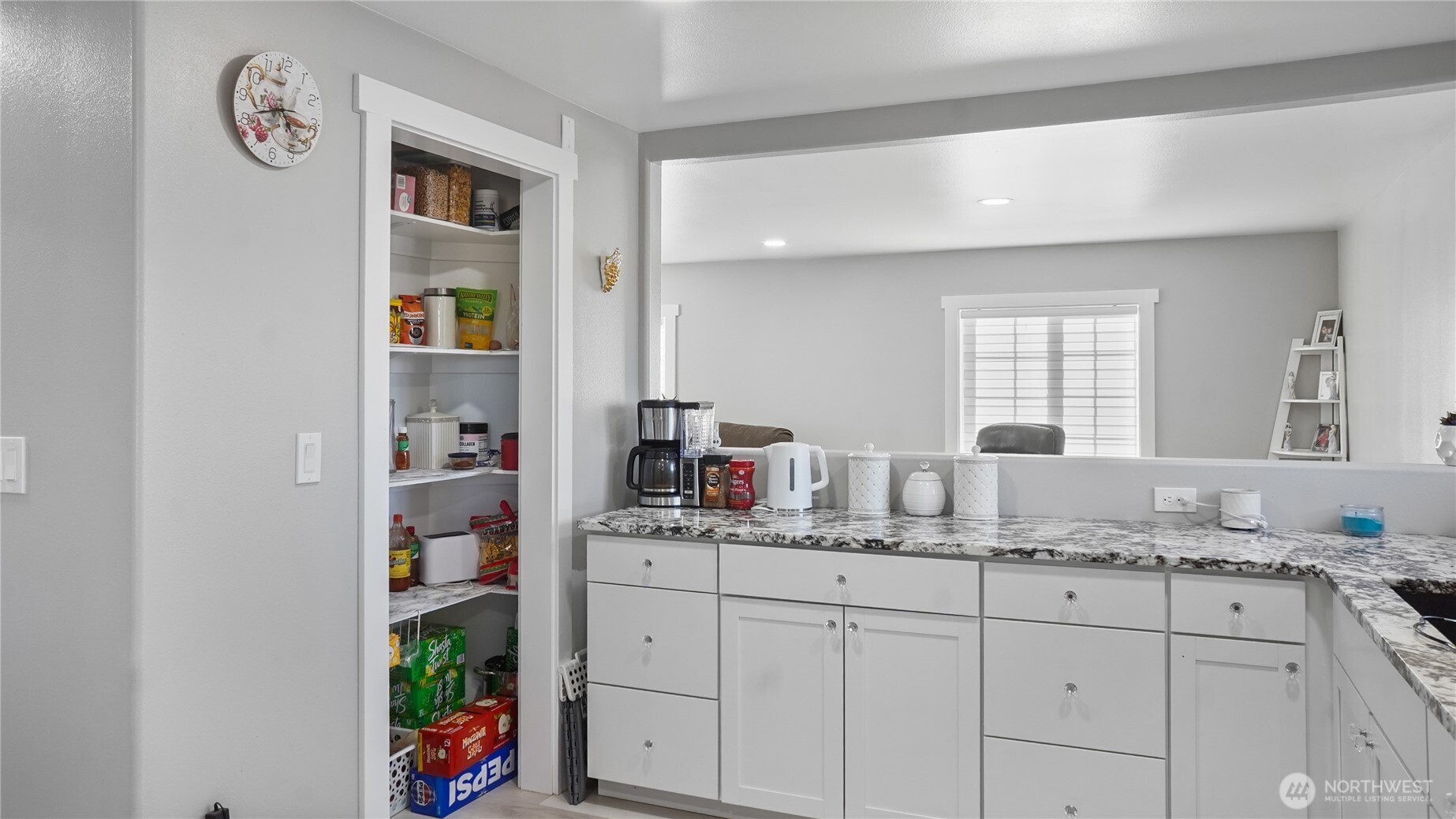 35 Hampton Road Othello, WA 99344 - Photo 24 of 33 a bathroom with a granite countertop sink and a window