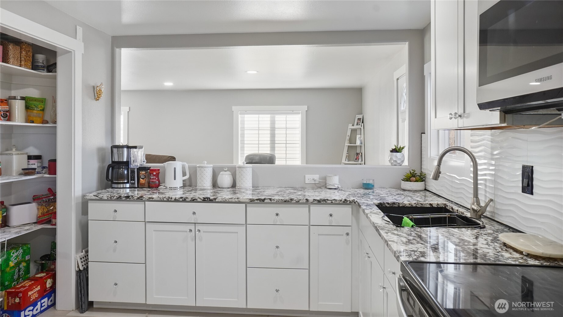 35 Hampton Road Othello, WA 99344 - Photo 25 of 33 a kitchen with stainless steel appliances granite countertop a sink stove and cabinets