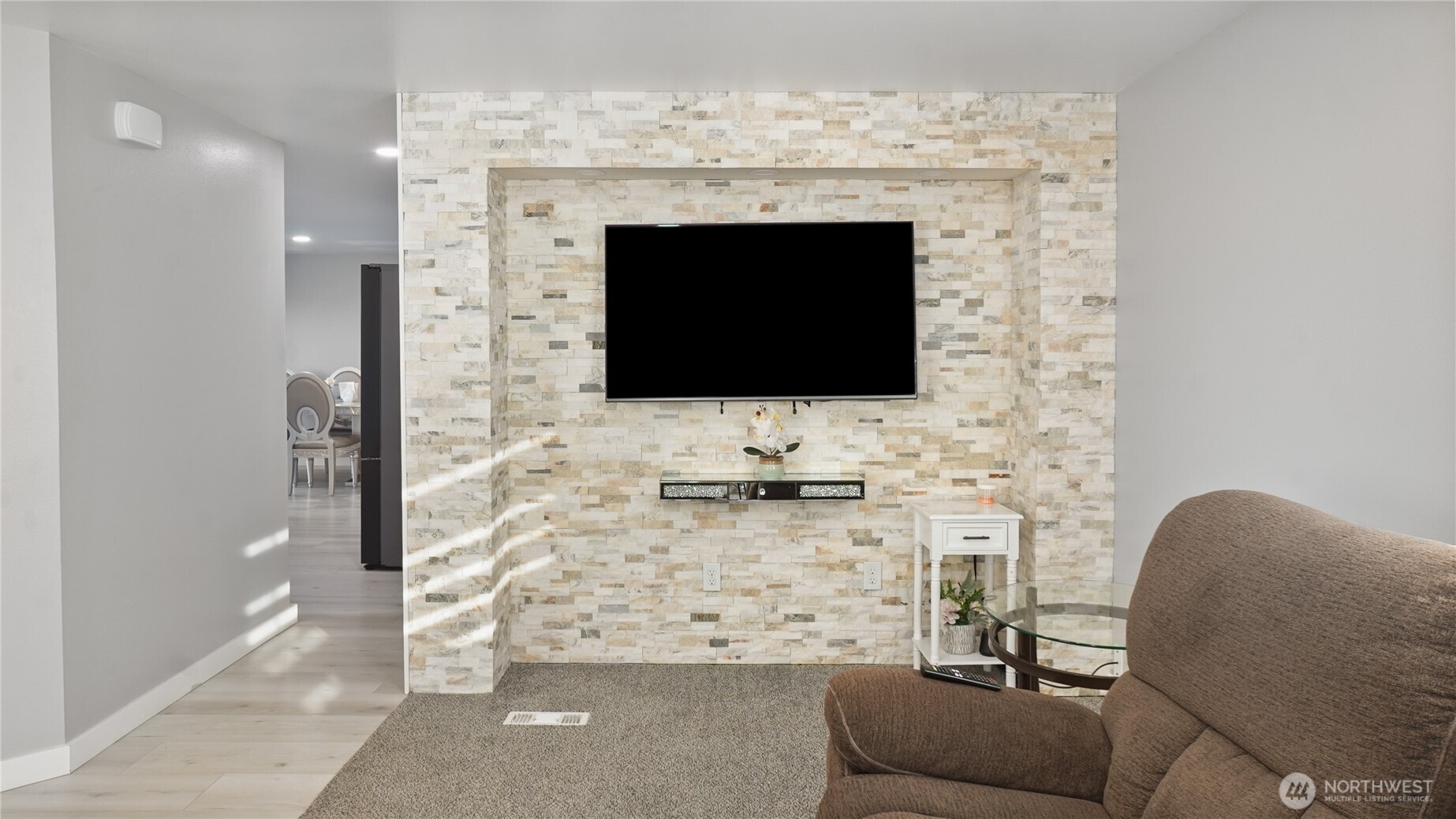 35 Hampton Road Othello, WA 99344 - Photo 6 of 33 a living room with furniture a flat screen tv and a fireplace