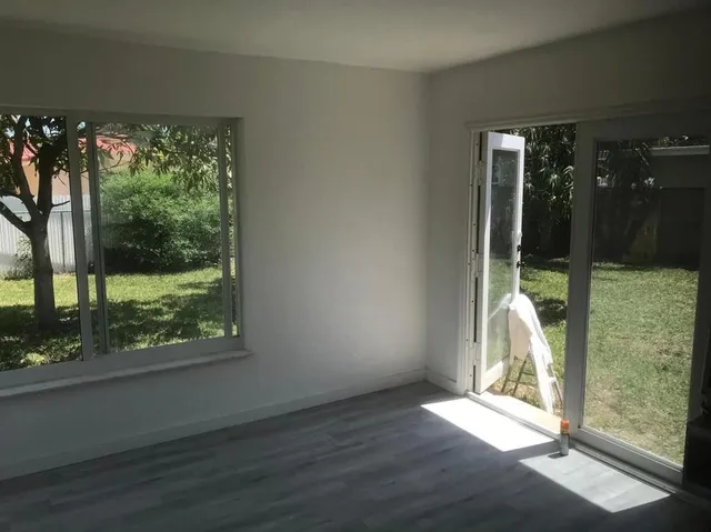 a view of a room with wooden floor and walls