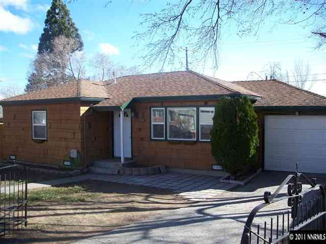 1960 Lassen Drive Reno, NV 89503 - Photo 1 of 13 a front view of a house with garden