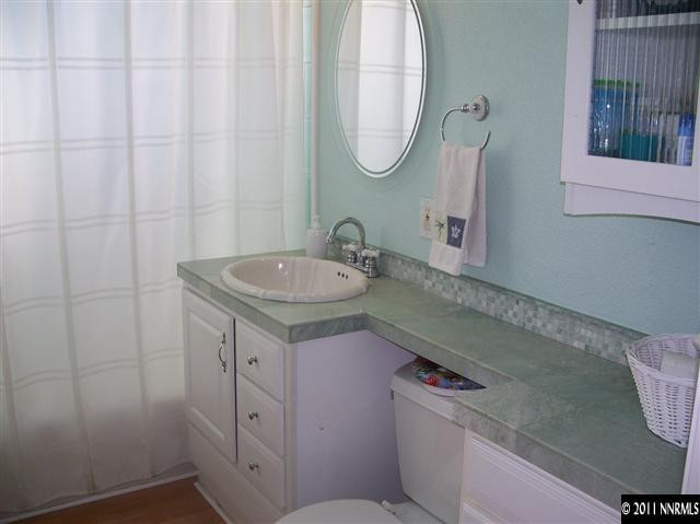 1960 Lassen Drive Reno, NV 89503 - Photo 7 of 13 a bathroom with a sink and a mirror
