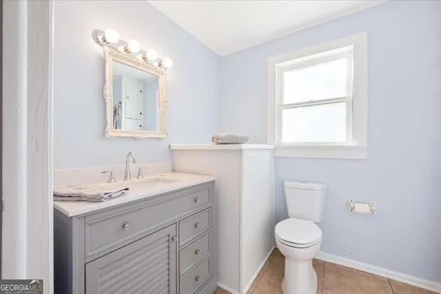 a bathroom with a toilet and shower
