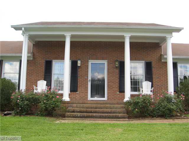 3734 Fieldview Road Pleasant Garden, NC 27313 - Photo 2 of 16 Exterior Front. Welcoming covered front porch with ornate columns, surrounded by beautiful flowering landscape. Shutters and door just painted to bring out a stately look that is sure to impress.