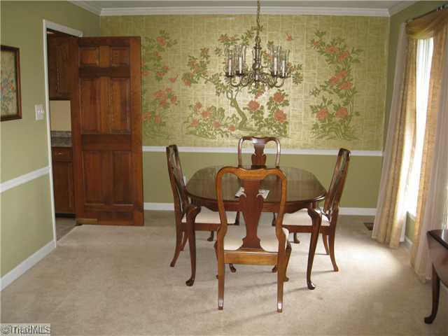 3734 Fieldview Road Pleasant Garden, NC 27313 - Photo 9 of 16 Dining Room. Detailed view of the formal dining room, shows the lovely moldings. Located right off the kitchen, which also has a breakfast nook.
