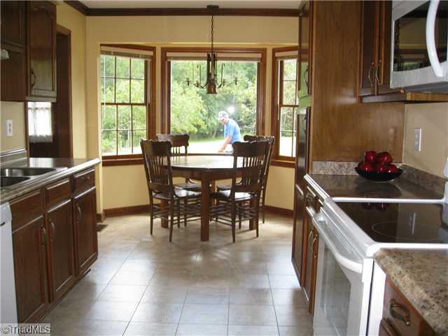 3734 Fieldview Road Pleasant Garden, NC 27313 - Photo 10 of 16 Kitchen. This kitchen was just renovated inclusive of new counter tops, new appliances, new faucet, new SS double sink, fresh neutral paint, new flooring. Lovely bay window that provides a great view of the back yard from the breakfast nook.