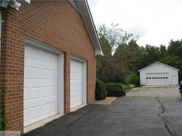 3734 Fieldview Road Pleasant Garden, NC 27313 - Photo 5 of 16 Exterior Front. Lots of parking and storage with this double port attached garage PLUS a detached two car garage/workshop. There is a storage room within the garage, overhead storage in the detached garage. Desirable huge expanded driveway.