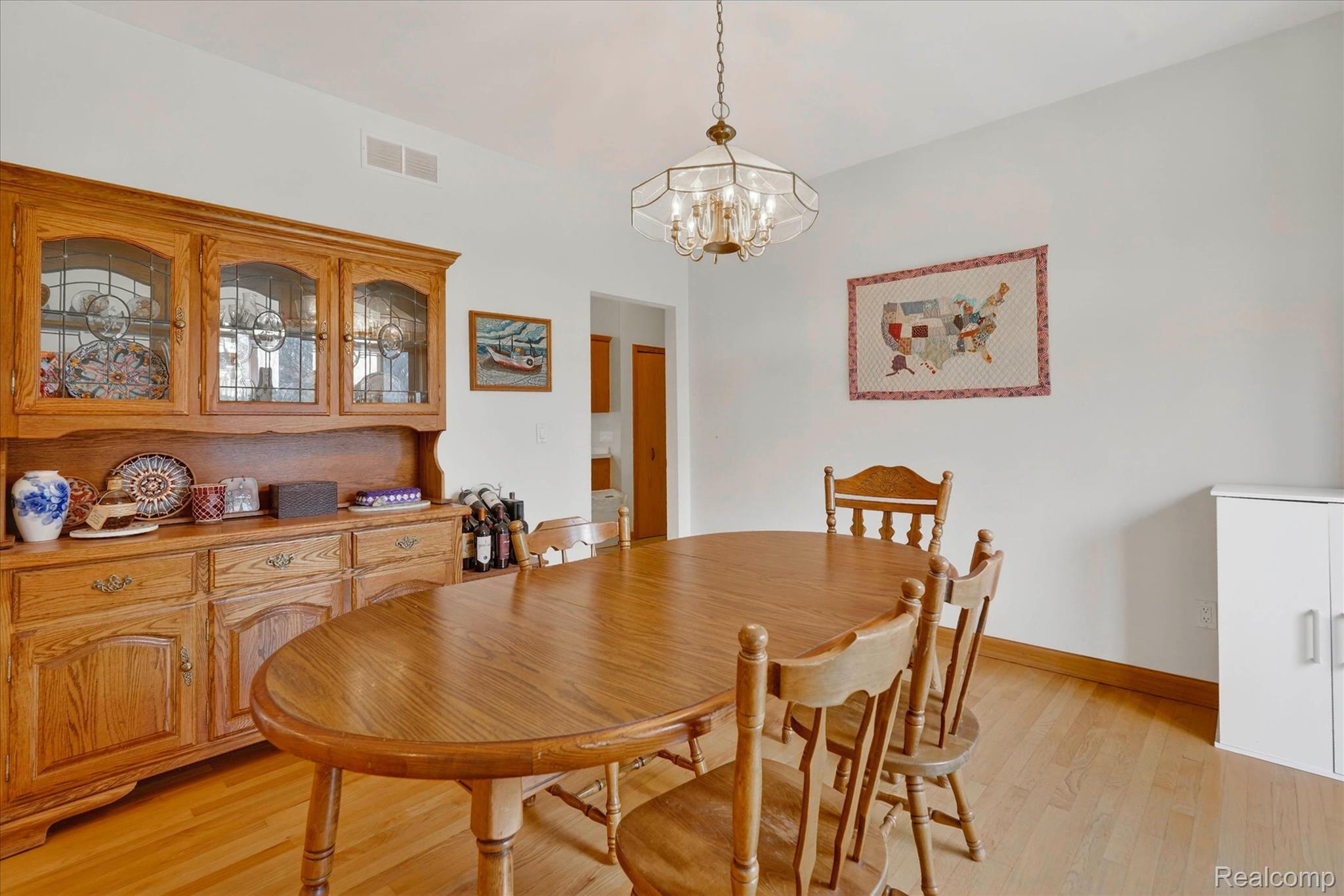 5640 Fisher Road Howell, MI 48855 - Photo 10 of 66 Dining room featuring light wood finished floors and hanging lights