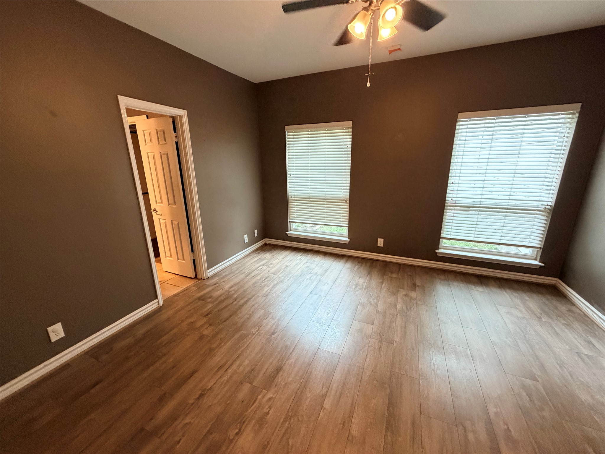6600 Valleyside Road, Unit D20 Austin, TX 78731 - Photo 8 of 14 A comfortable private retreat featuring warm wood-look flooring and ample natural illumination.