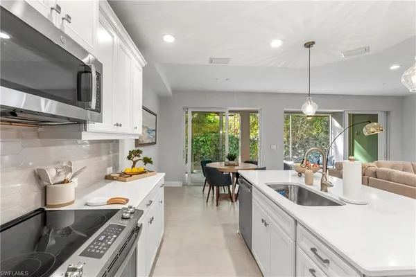 a kitchen that has a lot of cabinets in it