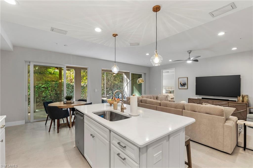 2640 Seychelles Circle, Unit 2802 Naples, FL 34112 - Photo 15 of 32 a view of living room with furniture and a flat screen tv