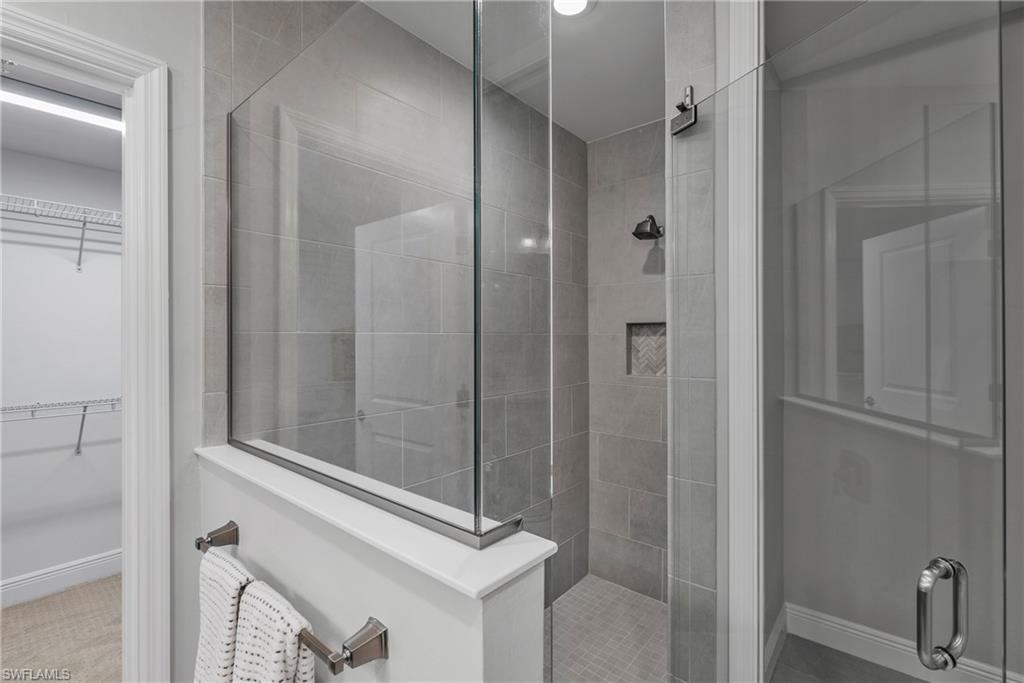2640 Seychelles Circle, Unit 2802 Naples, FL 34112 - Photo 26 of 32 a bathroom with a shower