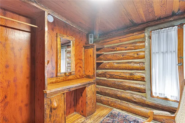 a view of a door and wooden floor
