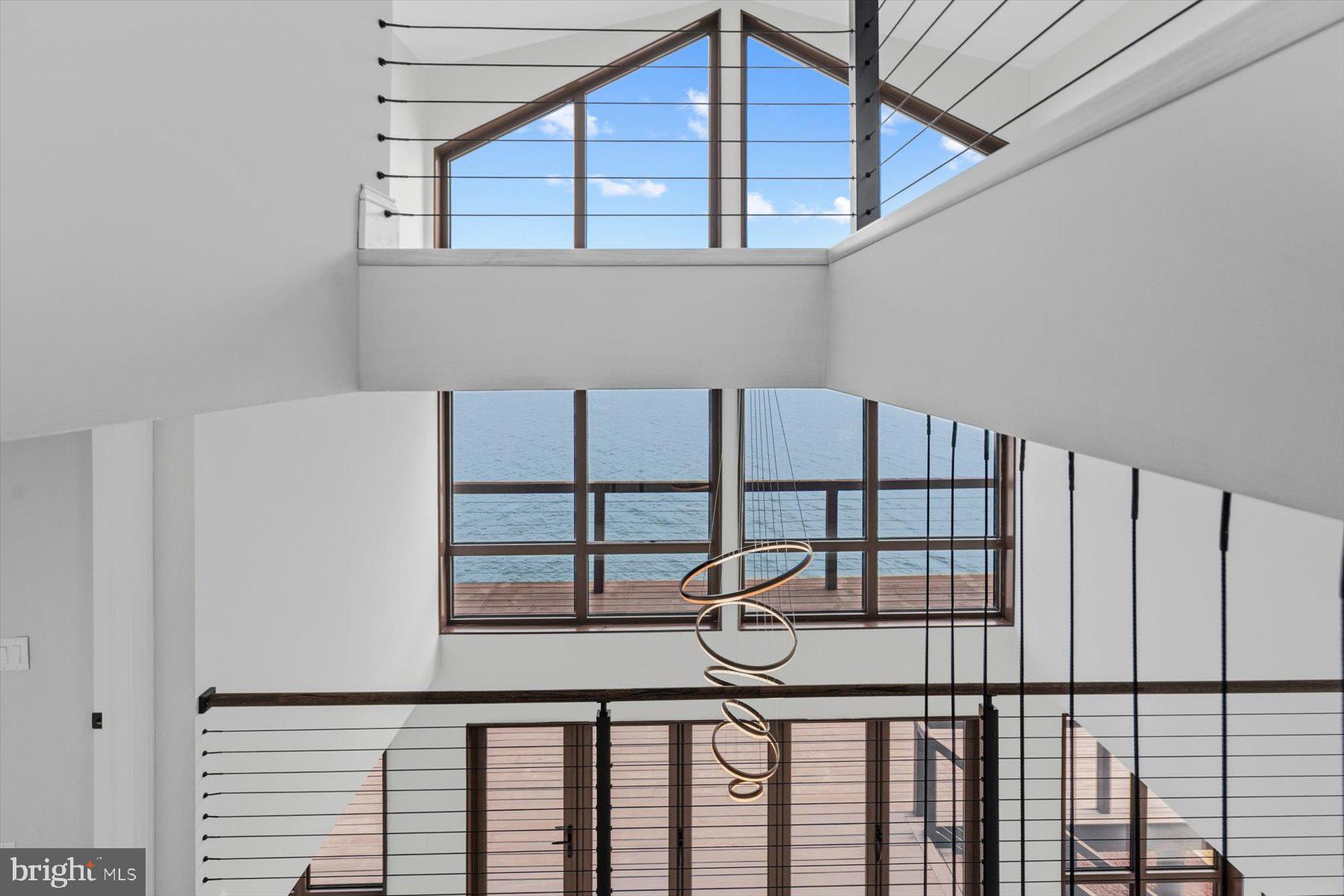 3407 Blackbeard Road Greenbackville, VA 23356 - Photo 15 of 106 Dramatic 2 Story Windows with Water Views