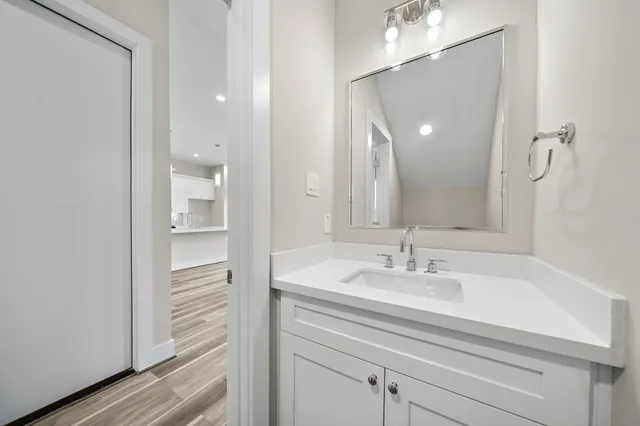 a bathroom with a sink and a mirror