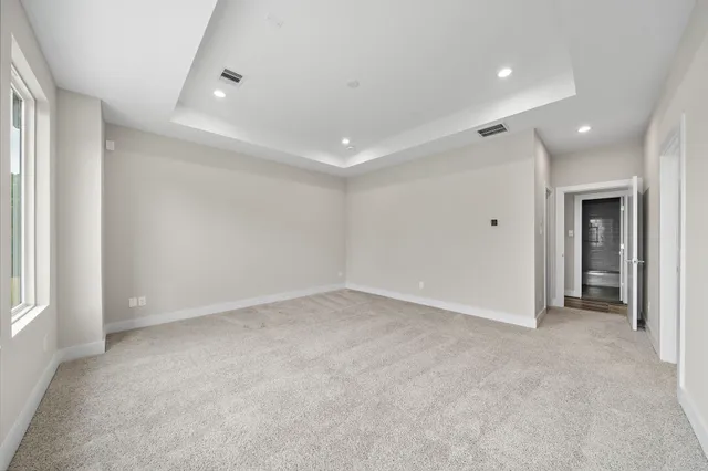 an empty room with a empty space and windows