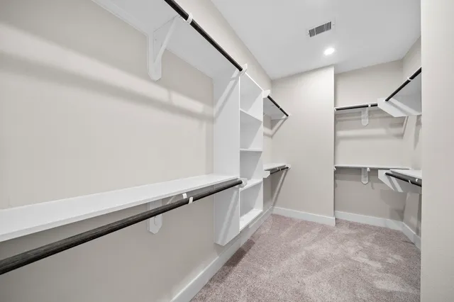 a view of an empty walk in closet