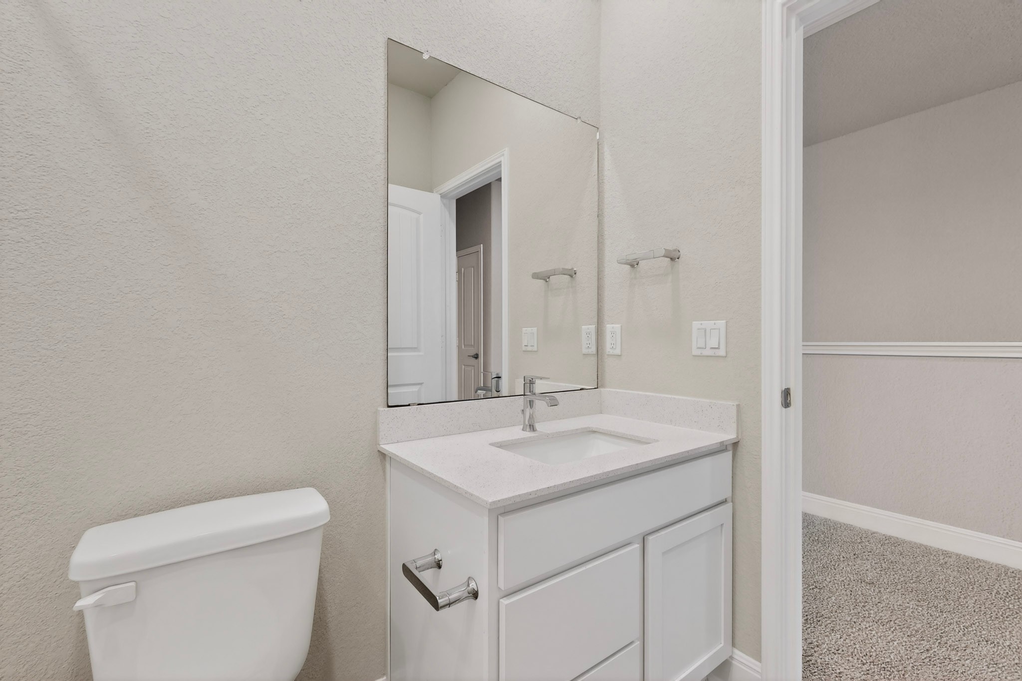 16809 Guido Cove Pflugerville, TX 78660 - Photo 25 of 40 Contemporary bathroom vanity with a white countertop and integrated rectangular sink