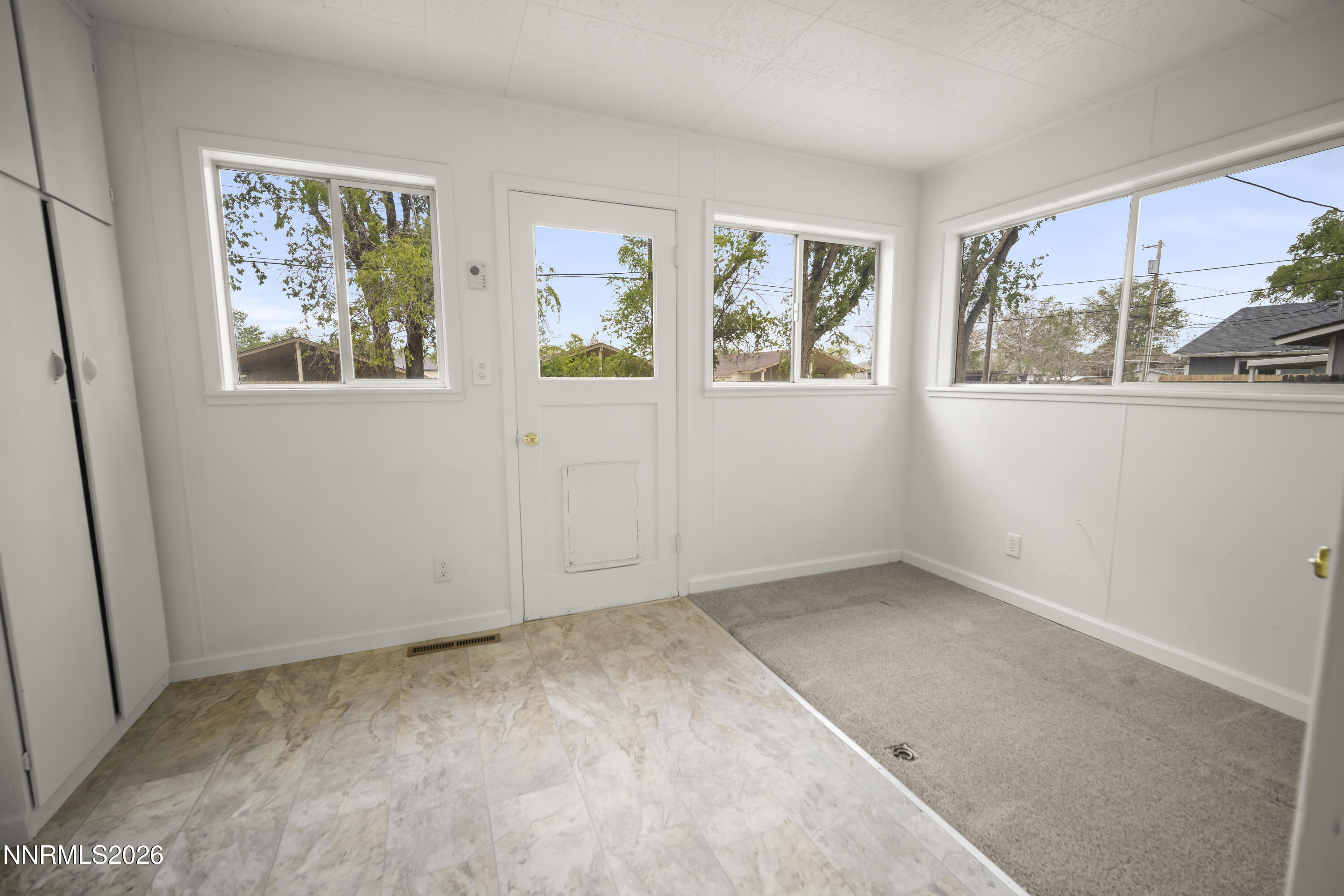 511 Churchill Street Fallon, NV 89406 - Photo 8 of 37 an empty room with windows