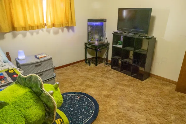 a room with furniture and a flat screen tv