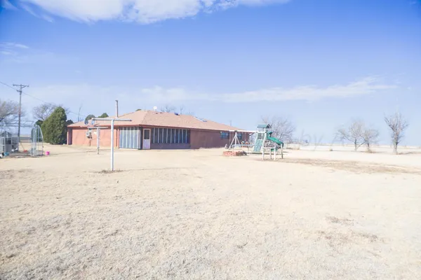 a view of swimming pool with a yard