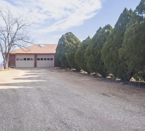 a view of large building with mountain in background
