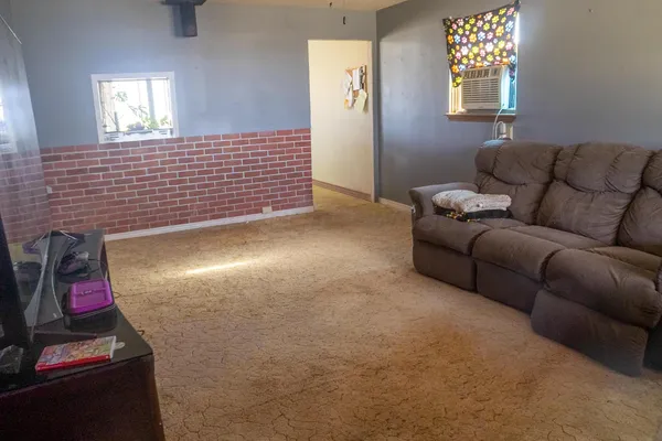 a view of livingroom with furniture and window