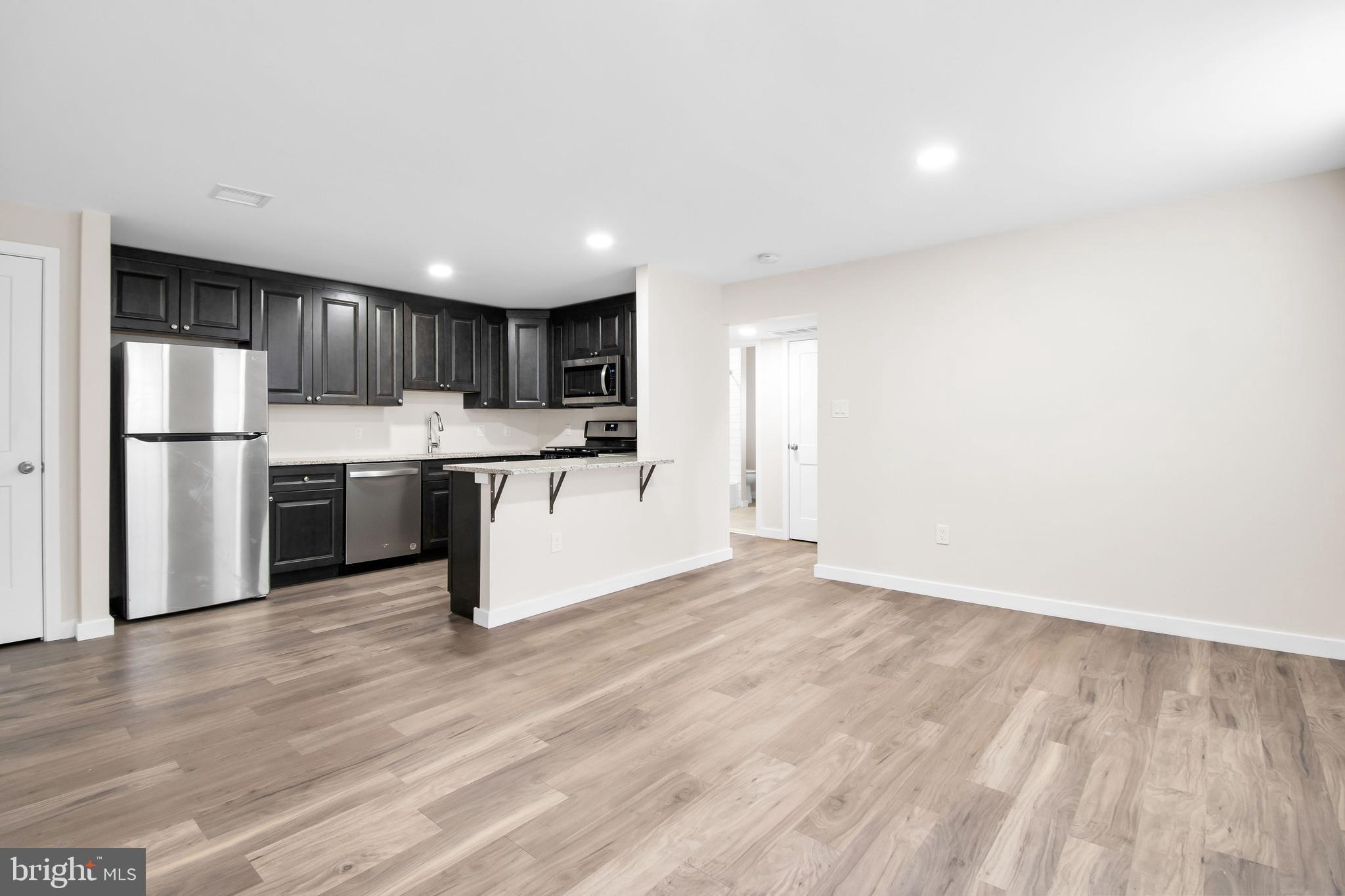 202 Foundry Street Florence, NJ 08518 - Photo 20 of 22 a kitchen with stainless steel appliances a refrigerator and a stove top oven