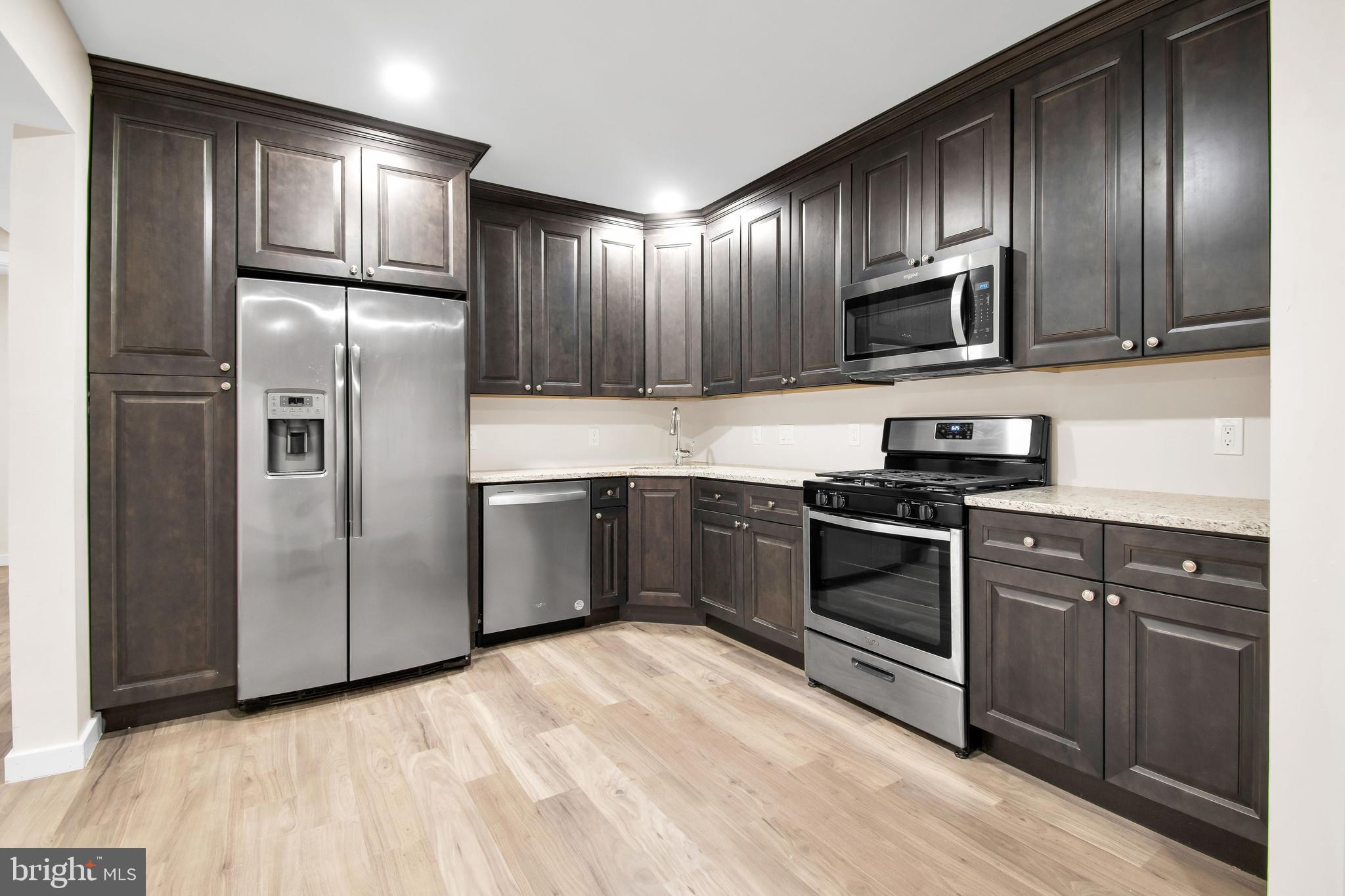 202 Foundry Street Florence, NJ 08518 - Photo 7 of 22 a kitchen with stainless steel appliances granite countertop a refrigerator stove a sink and microwave