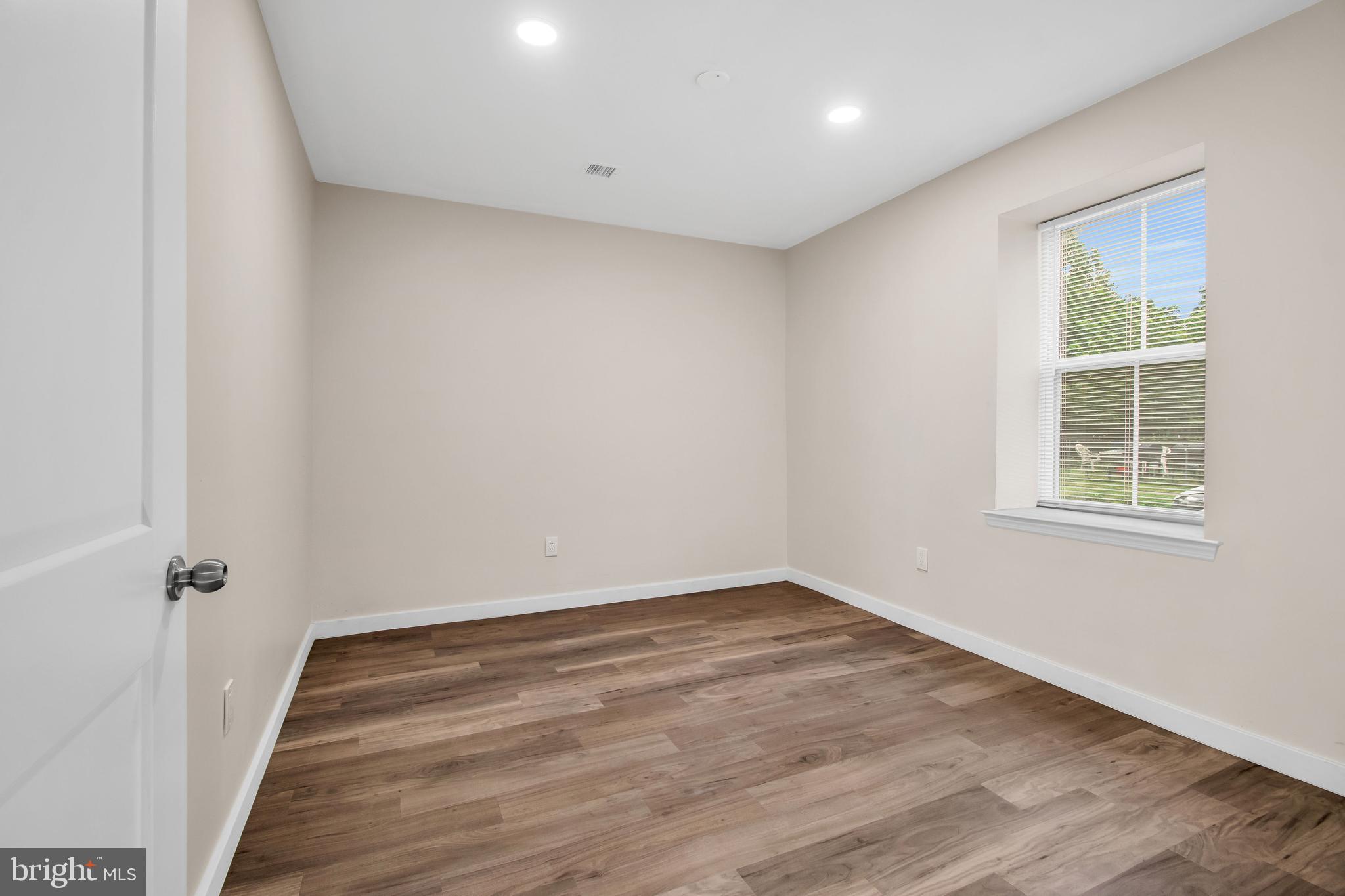 202 Foundry Street Florence, NJ 08518 - Photo 10 of 22 wooden floor in an empty room with a window