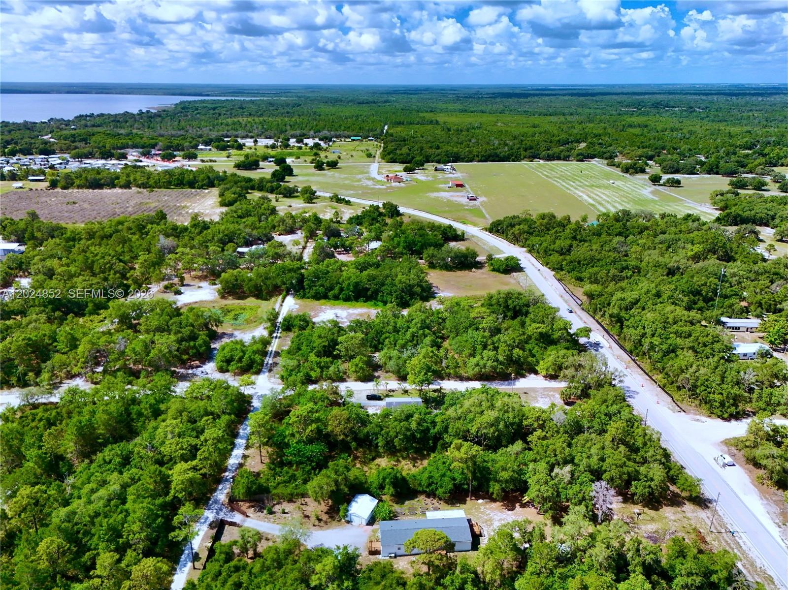 3175 Walk In Water Road Lake Wales, FL 33898 - Photo 8 of 35 an aerial view of a houses with outdoor space and city view